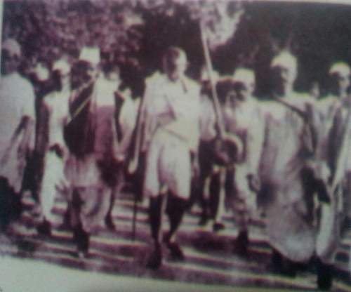 Mahatma gandhi is on the march in the photograph.to march was one of the methods for the non-violent