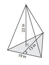 Find the volume of the triangular pyramid to the nearest whole number. a) 679 in3 b) 906 in3 c) 1,