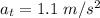 a_t = 1.1\ m/s^2