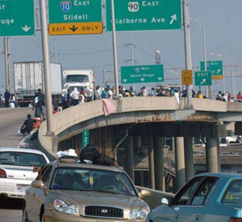 The photo at right shows people traveling to seek shelter in New Orleans following Hurricane Katrina