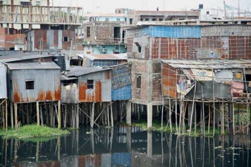These houses are built in a flood prone area of Bangladesh. What is the term for the geographic con