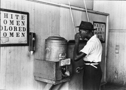 PLEASE HELP!!!

The policy of segregation illustrated in this image taken in 1939 was determined t