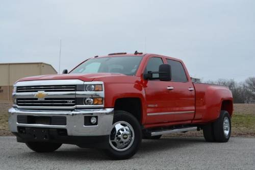 Me and my family's trucks red Chevy is my dads black GMC is my moms and the ford is mine